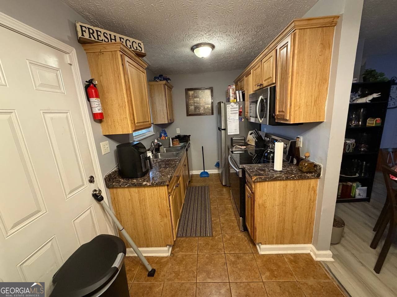1137 Reed Place Monroe, GA 30655 - Photo 3 of 10 a living room with furniture a flat screen tv and a window
