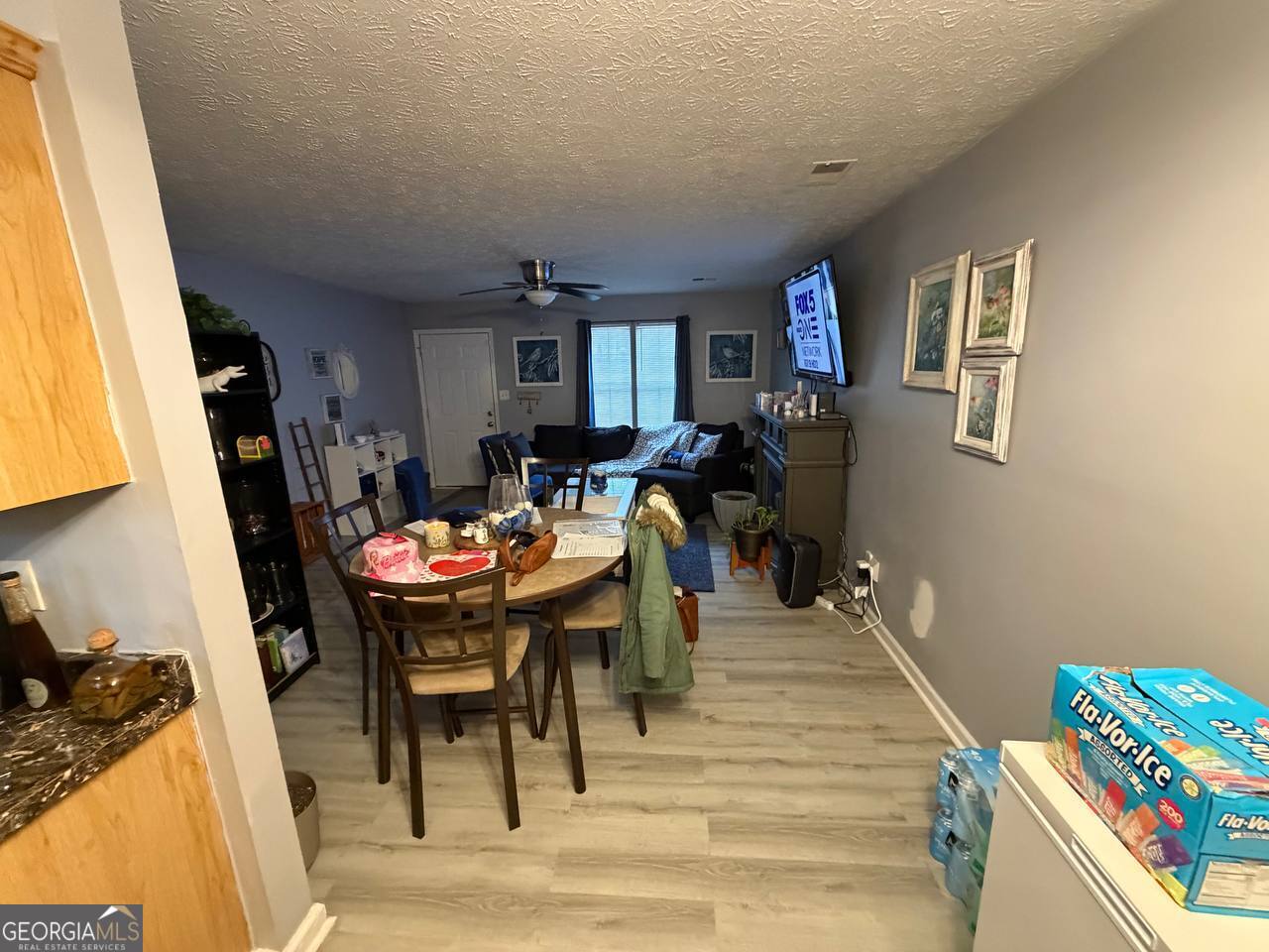1137 Reed Place Monroe, GA 30655 - Photo 5 of 10 a view of a dining room with furniture and wooden floor