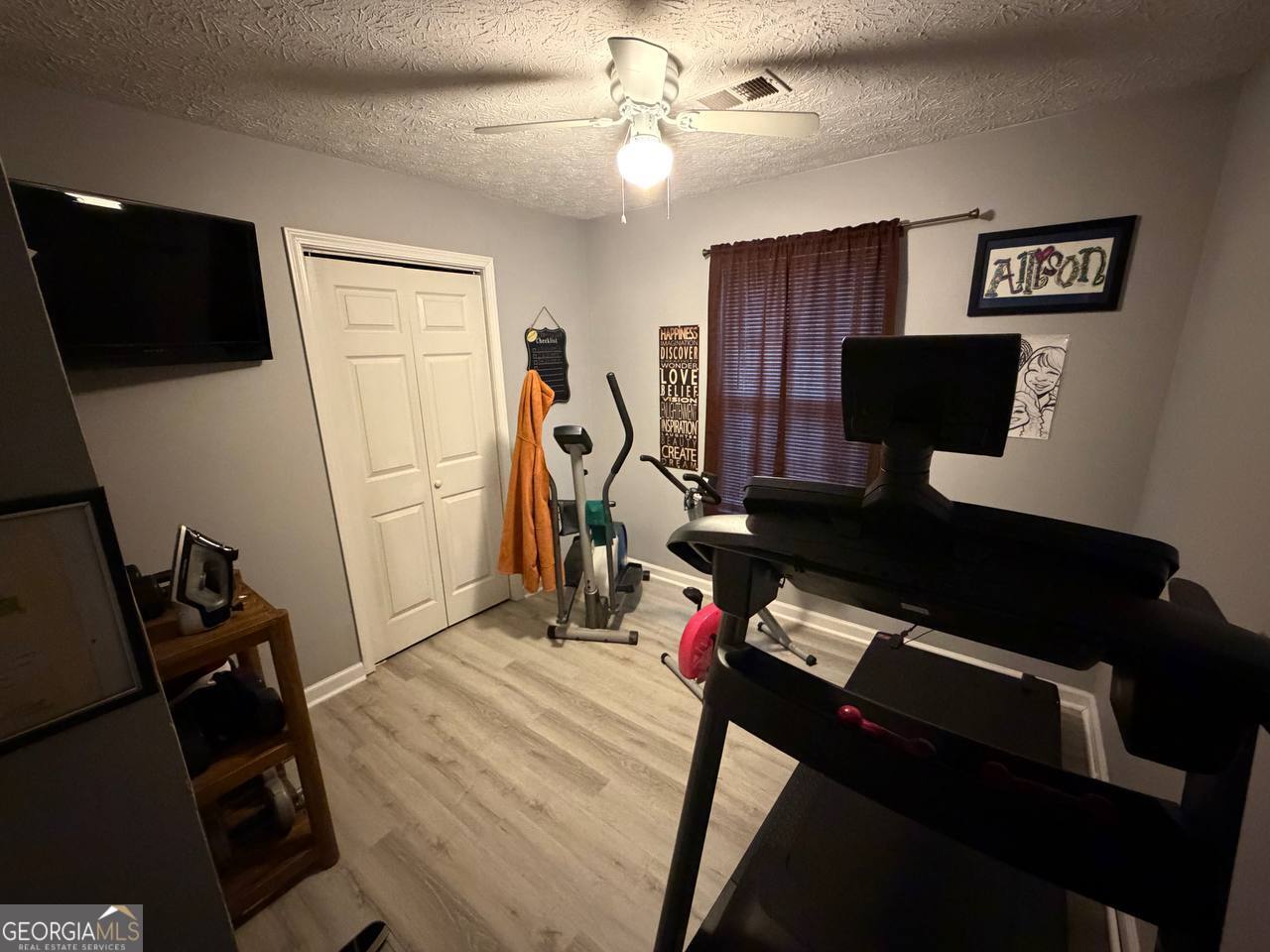 1137 Reed Place Monroe, GA 30655 - Photo 8 of 10 a bedroom with furniture and a window