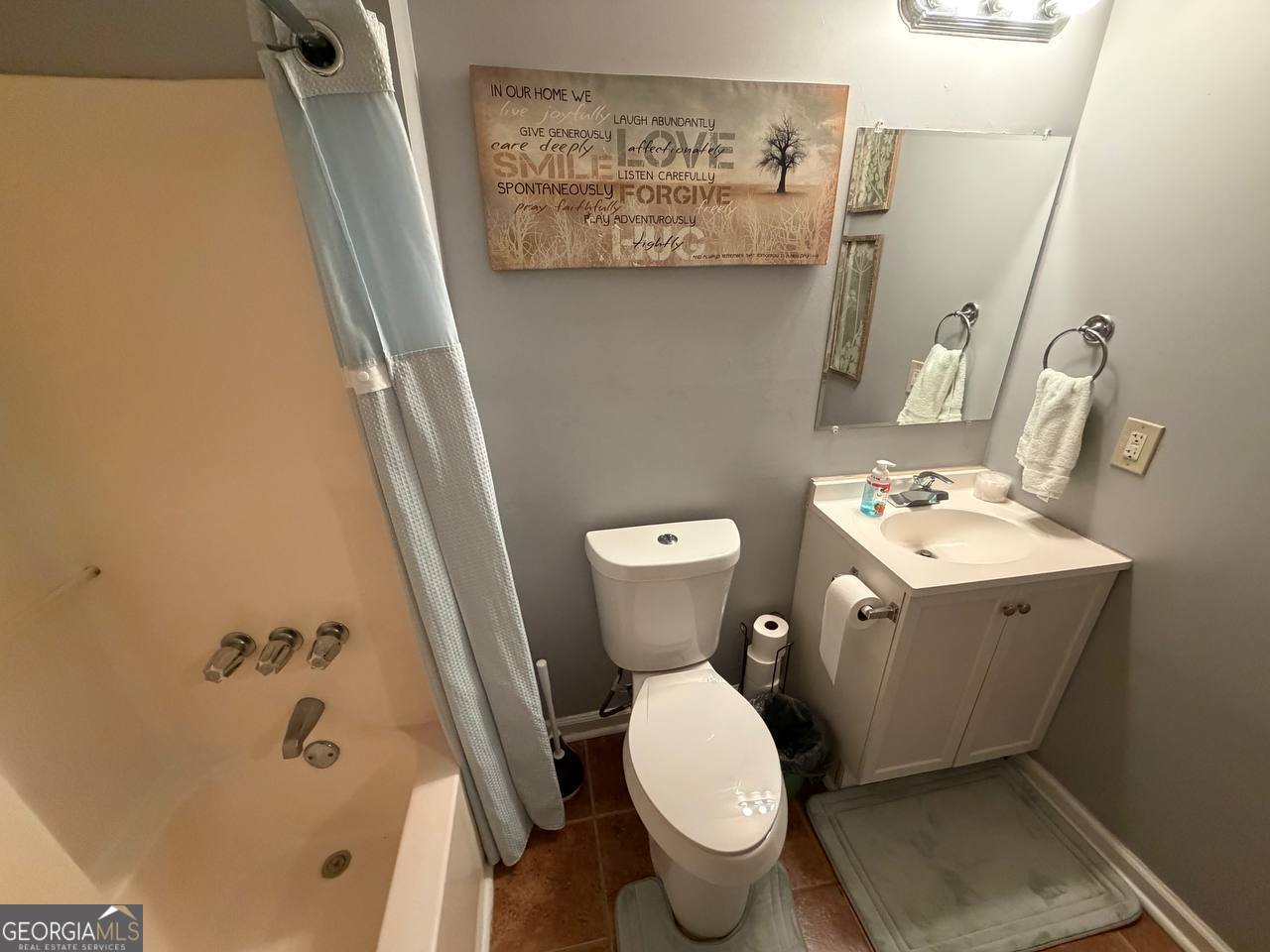 1137 Reed Place Monroe, GA 30655 - Photo 10 of 10 a white toilet sitting next to a bathroom sink