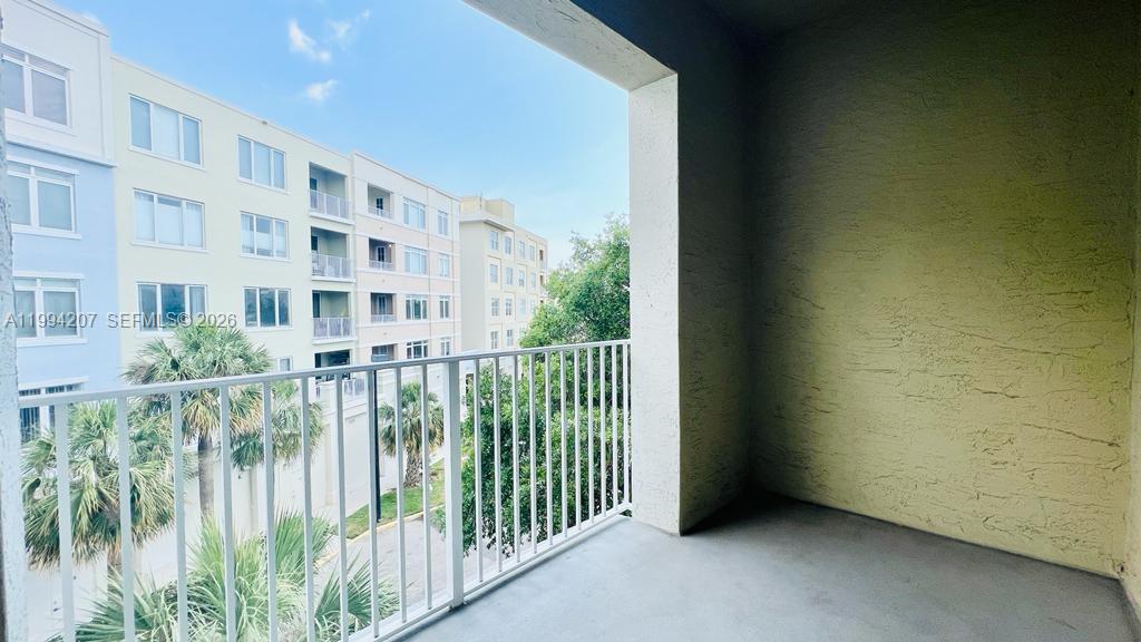 1209 Main Street, Unit 315 Jupiter, FL 33458 - Photo 18 of 18 a view of a building from a balcony