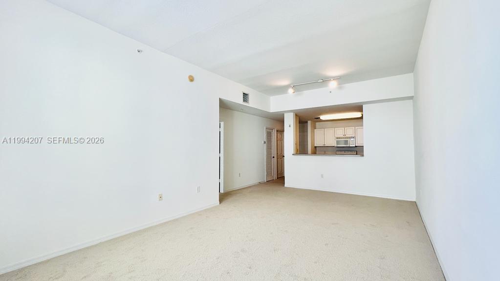 1209 Main Street, Unit 315 Jupiter, FL 33458 - Photo 5 of 18 a view of an empty room