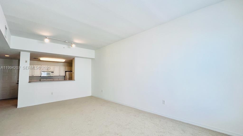 1209 Main Street, Unit 315 Jupiter, FL 33458 - Photo 6 of 18 a view of an empty room and window