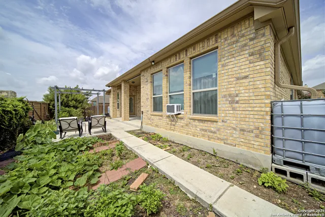 a view of house and yard with green space