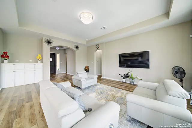 a living room with furniture and a large window