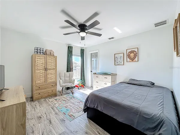 a view of a livingroom with furniture and hardwood floor