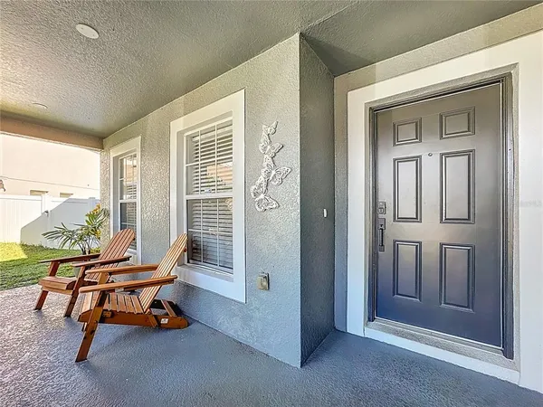 a view of a hallway with wooden floor and closet