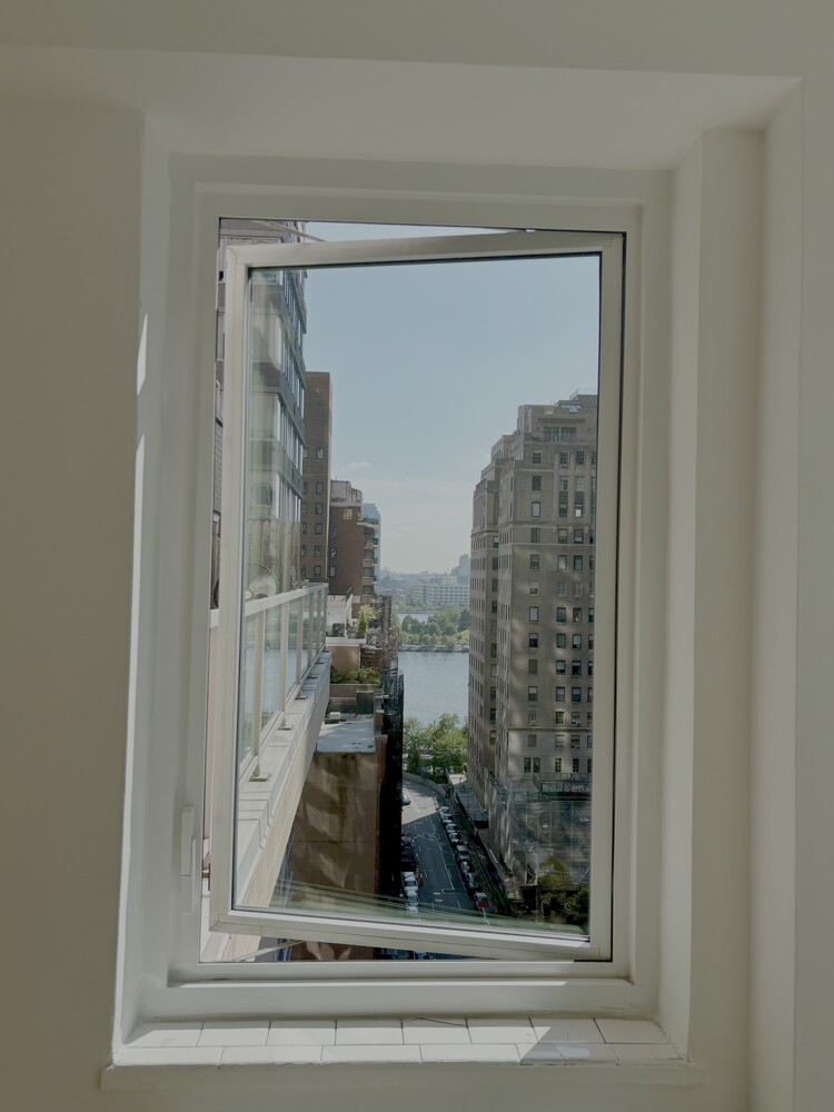 411 East 53rd Street, Unit 14F Manhattan, NY 10022 - Photo 13 of 20 a view of a glass door