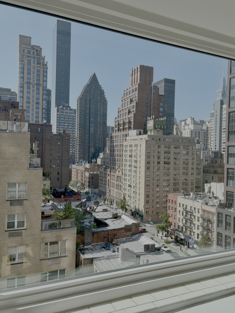 411 East 53rd Street, Unit 14F Manhattan, NY 10022 - Photo 15 of 20 a view of building with entryway