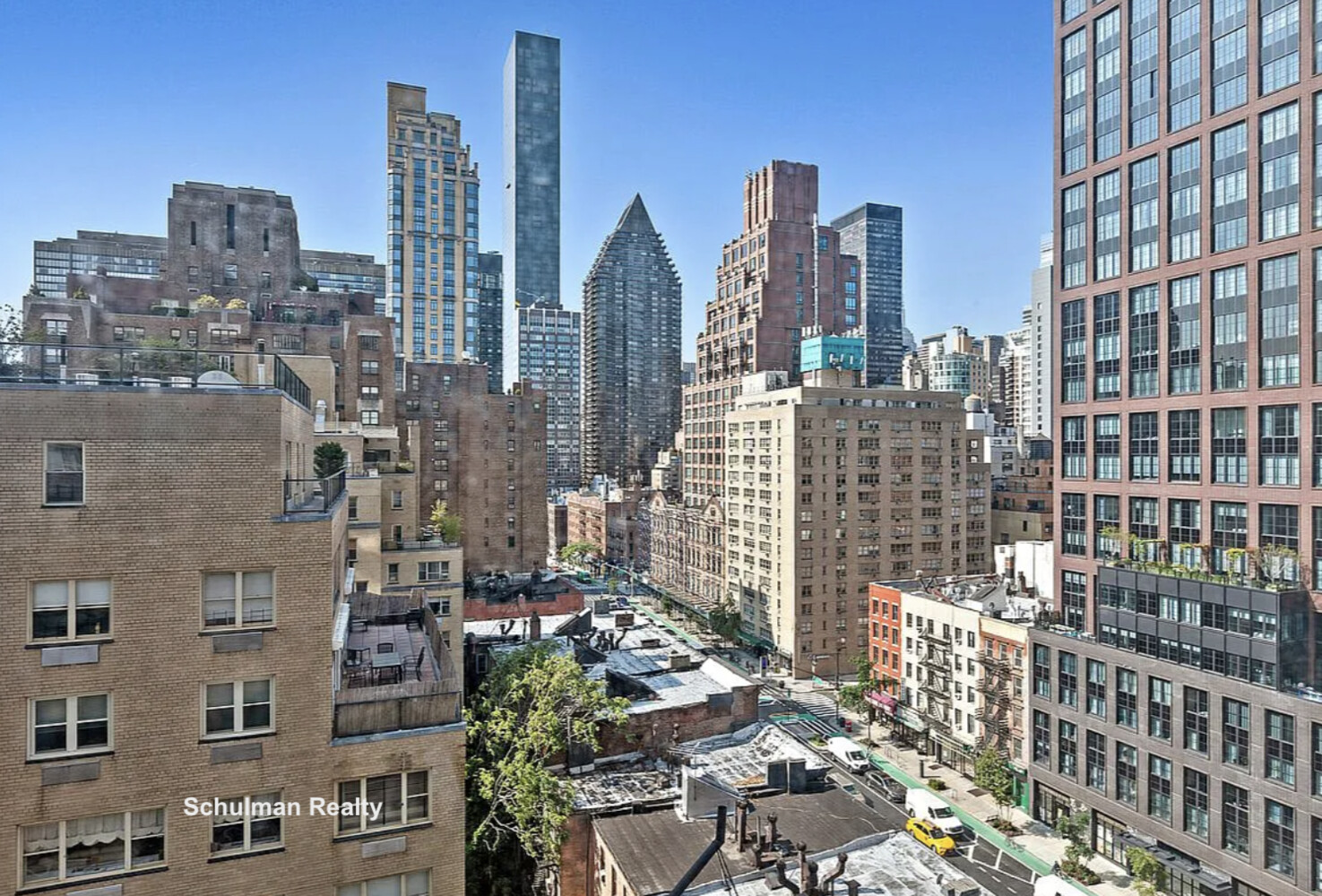 411 East 53rd Street, Unit 14F Manhattan, NY 10022 - Photo 16 of 20 a view of city with tall buildings