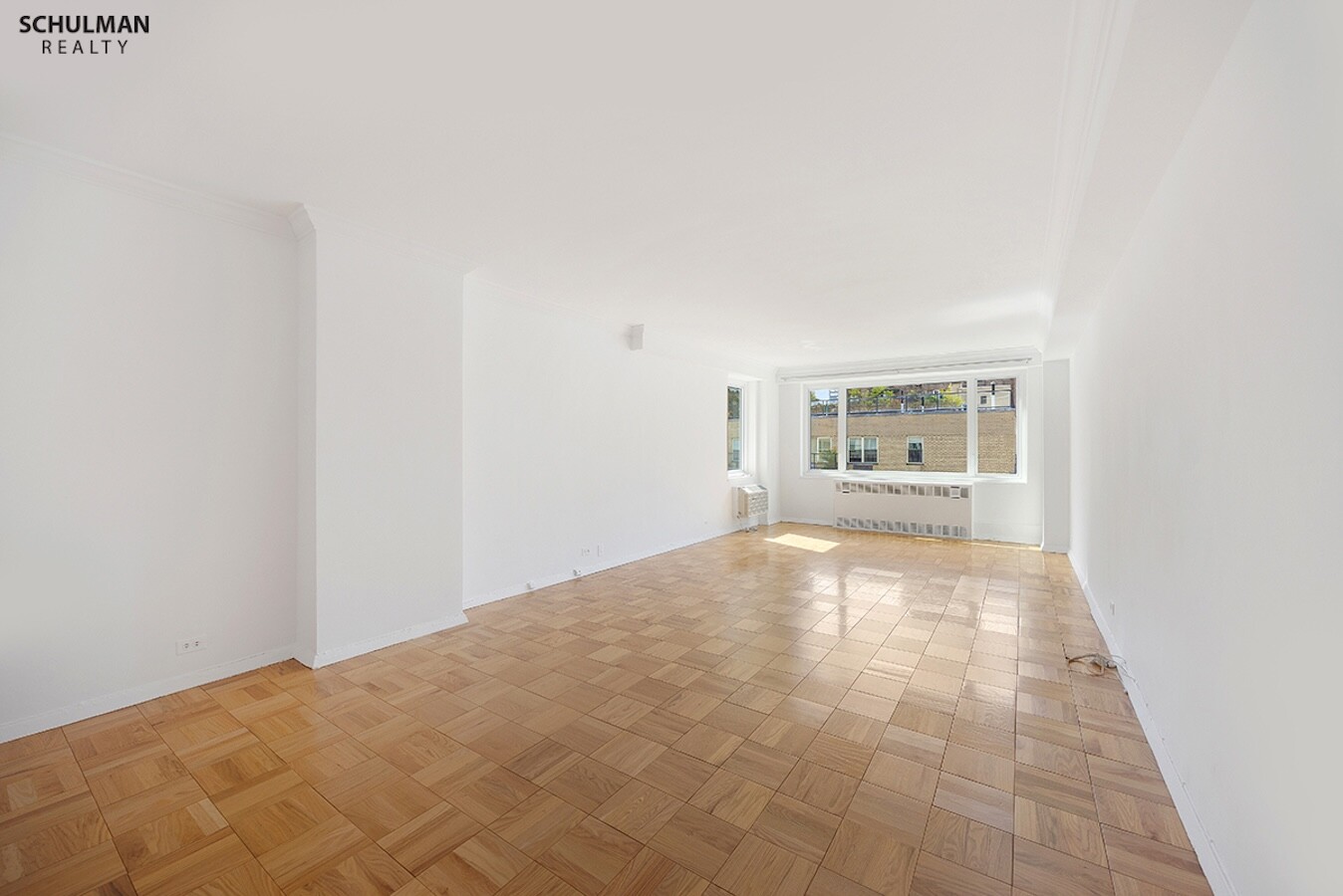 411 East 53rd Street, Unit 14F Manhattan, NY 10022 - Photo 3 of 20 a view of an empty room with a window