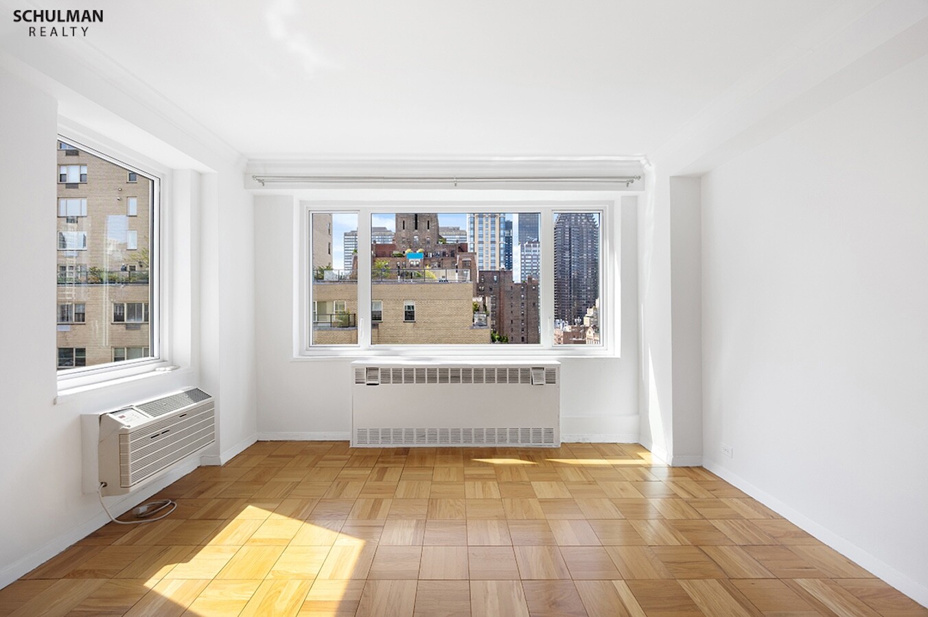 411 East 53rd Street, Unit 14F Manhattan, NY 10022 - Photo 7 of 20 a view of an empty room with a window