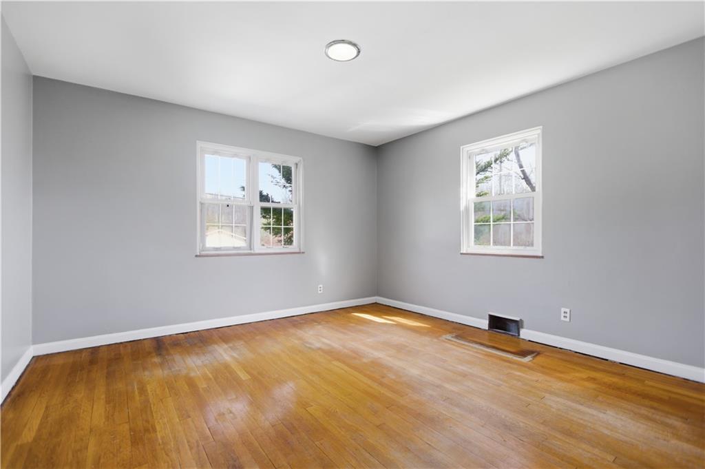 64 Harmon Creek Road Burgettstown, PA 15021 - Photo 14 of 29 a view of an empty room with wooden floor and a window