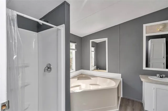 a en suite bathroom with a sink and mirror