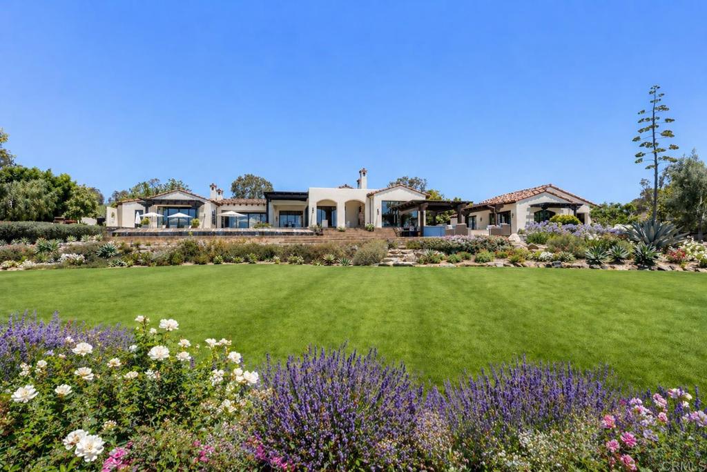 5293 La Glorieta Rancho Santa Fe, CA 92067 - Photo 1 of 25 a view of a big house with a big yard and large trees