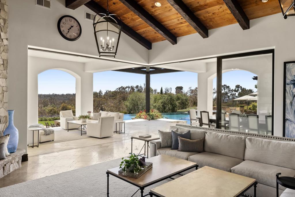 5293 La Glorieta Rancho Santa Fe, CA 92067 - Photo 3 of 25 a living room with patio furniture and a floor to ceiling window