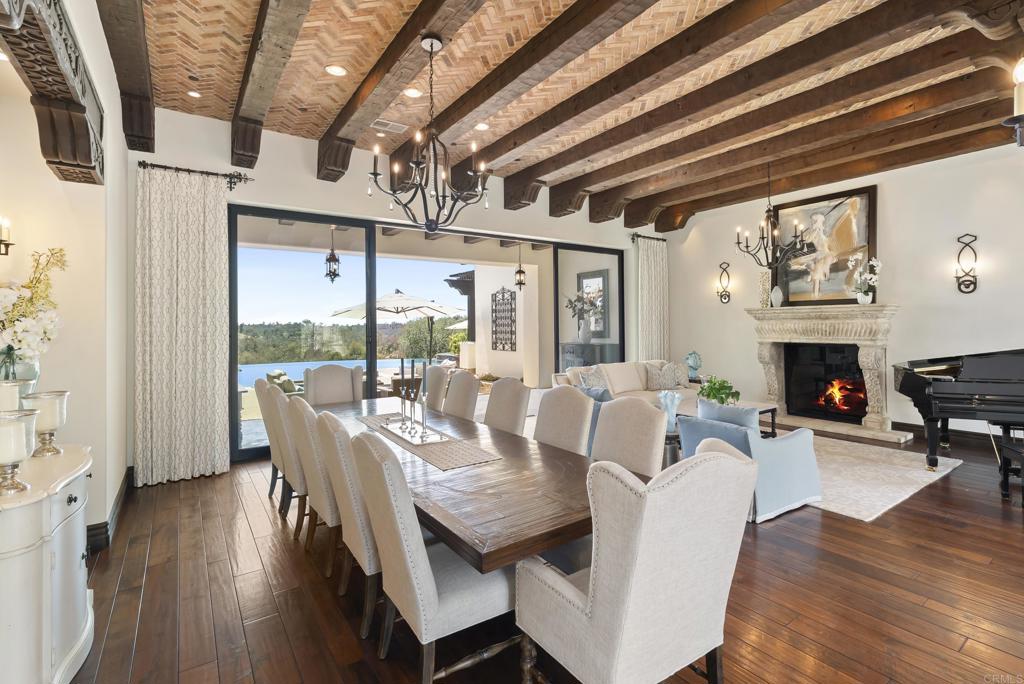 5293 La Glorieta Rancho Santa Fe, CA 92067 - Photo 10 of 25 a view of a dining room with furniture window and wooden floor