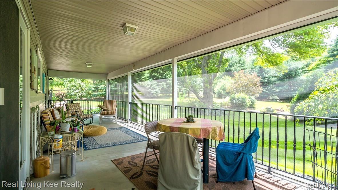 247 Whims Court Rochester, MI 48306 - Photo 20 of 57 Heres the patio outside of the kitchen, goes all the way to the end of the house. Beautiful courtyard on other side.