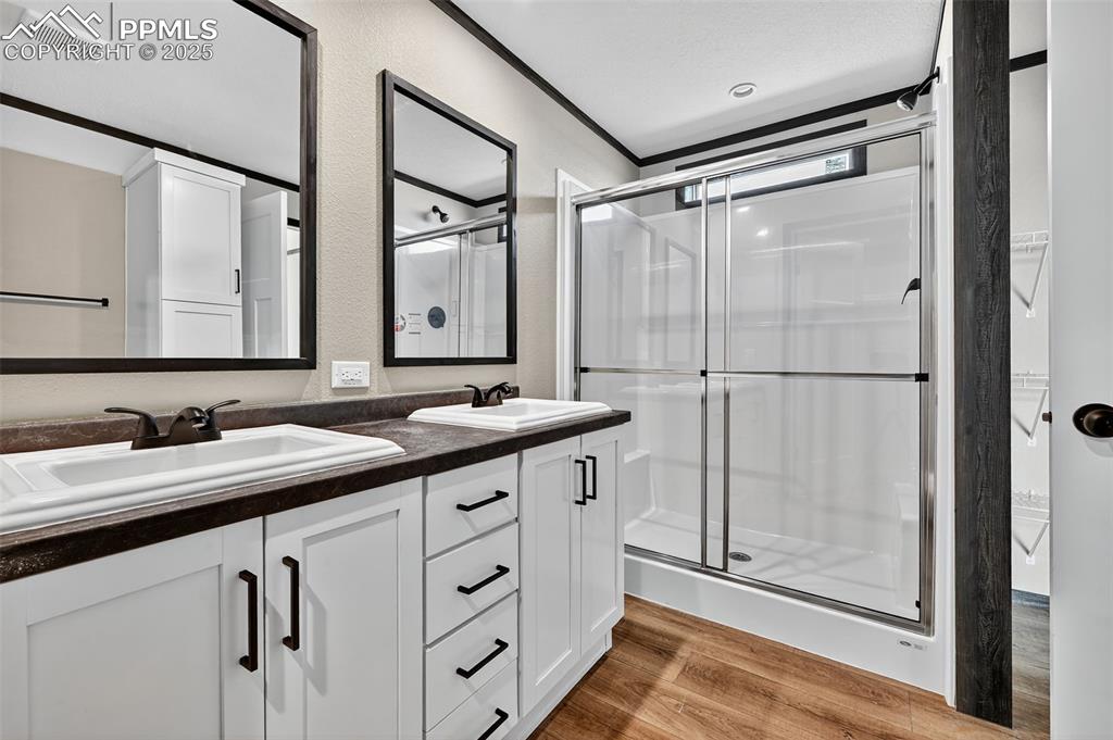 6815 Ramah Highway Yoder, CO 80864 - Photo 18 of 39 a bathroom with a double vanity sink mirror and shower
