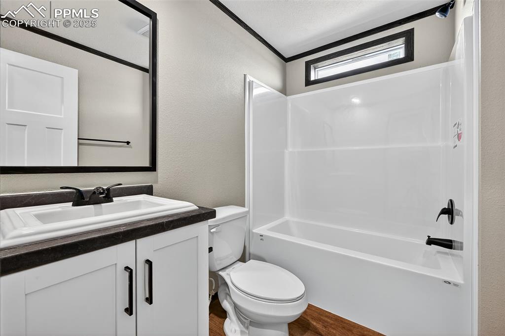 6815 Ramah Highway Yoder, CO 80864 - Photo 22 of 39 a bathroom with a sink a toilet and a bathtub