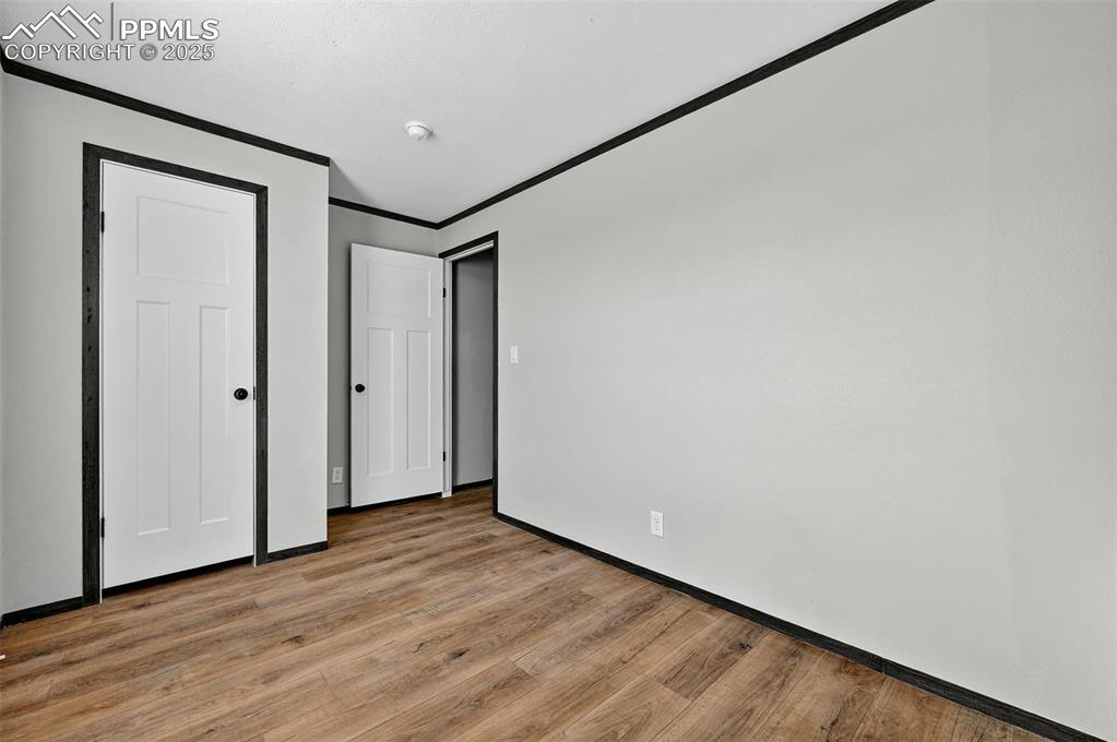 6815 Ramah Highway Yoder, CO 80864 - Photo 24 of 39 a view of empty room with wooden floor