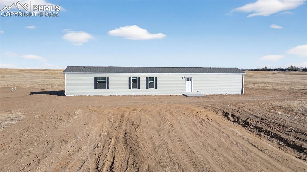 6815 Ramah Highway Yoder, CO 80864 - Photo 6 of 39 a house view with a lake