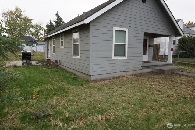 a backyard of a house with seating space
