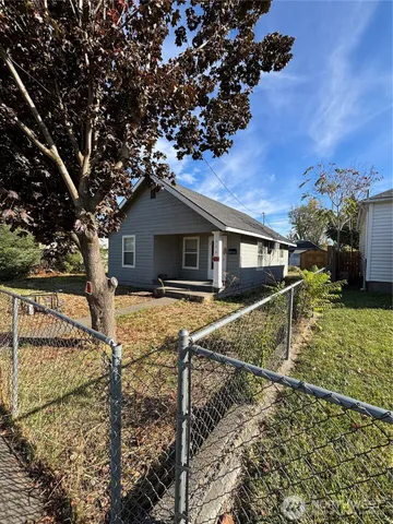 a house with trees in the background