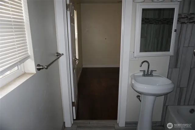 a bathroom with a sink and a mirror