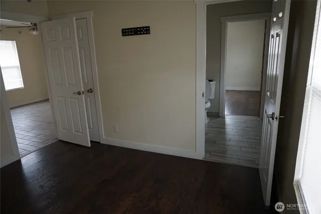 an empty room with wooden floor