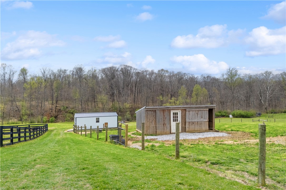 1158 Pyle Road Clarksville, OH 45113 - Photo 68 of 76 This expansive lot features two versatile outbuildings, perfect for various uses amidst lush green pastures.