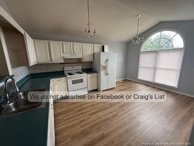 113 Kristin Avenue Spring Lake, NC 28390 - Photo 2 of 11 a kitchen with granite countertop a stove a sink and a microwave