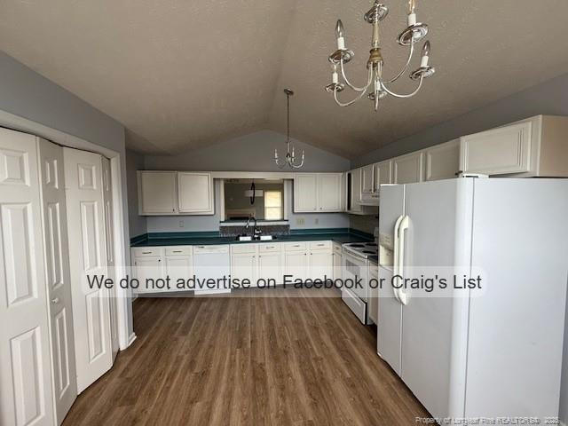 113 Kristin Avenue Spring Lake, NC 28390 - Photo 3 of 11 a kitchen with kitchen island granite countertop a refrigerator a stove top oven a sink and dishwasher with wooden floor