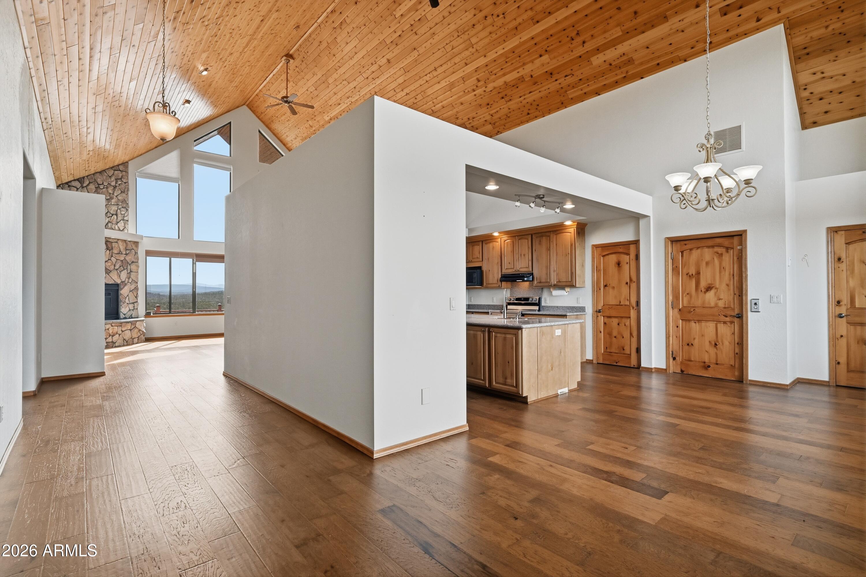 1561 South Canyon Ridge Trail Show Low, AZ 85901 - Photo 9 of 61 a view of open kitchen with wooden floor and electronic appliances