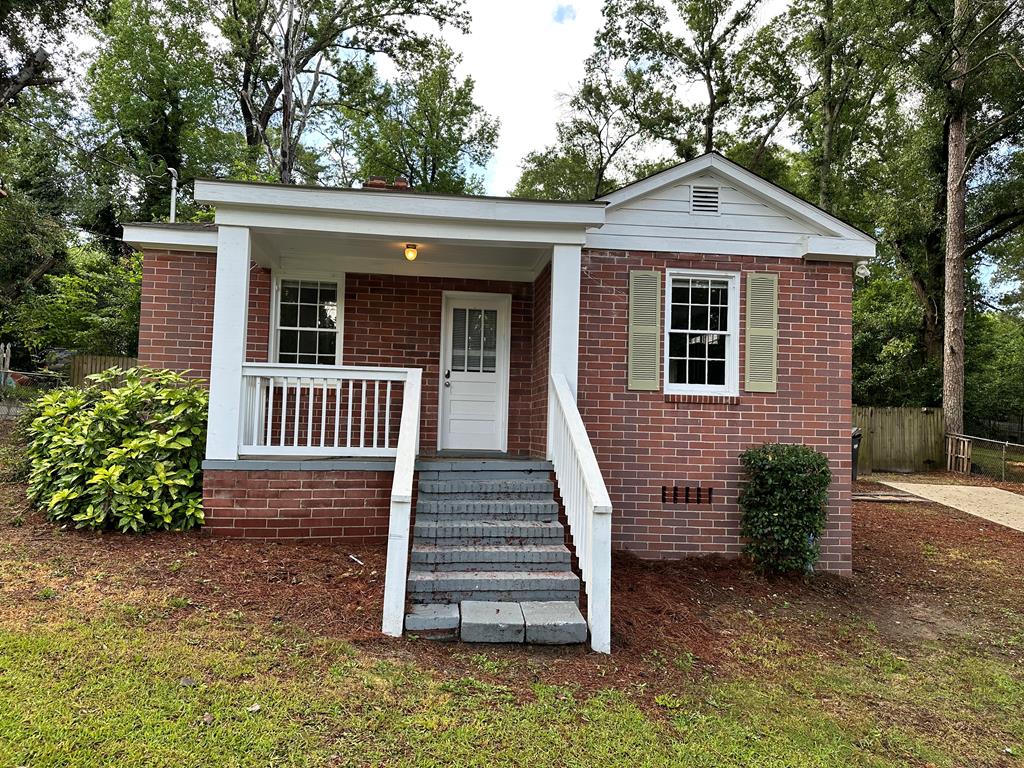 front view of a house with a yard