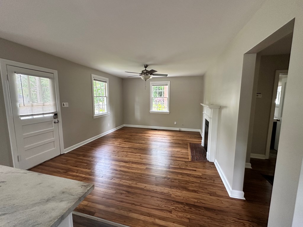 3136 Norris Road Columbus, GA 31907 - Photo 13 of 17 an empty room with wooden floor and windows