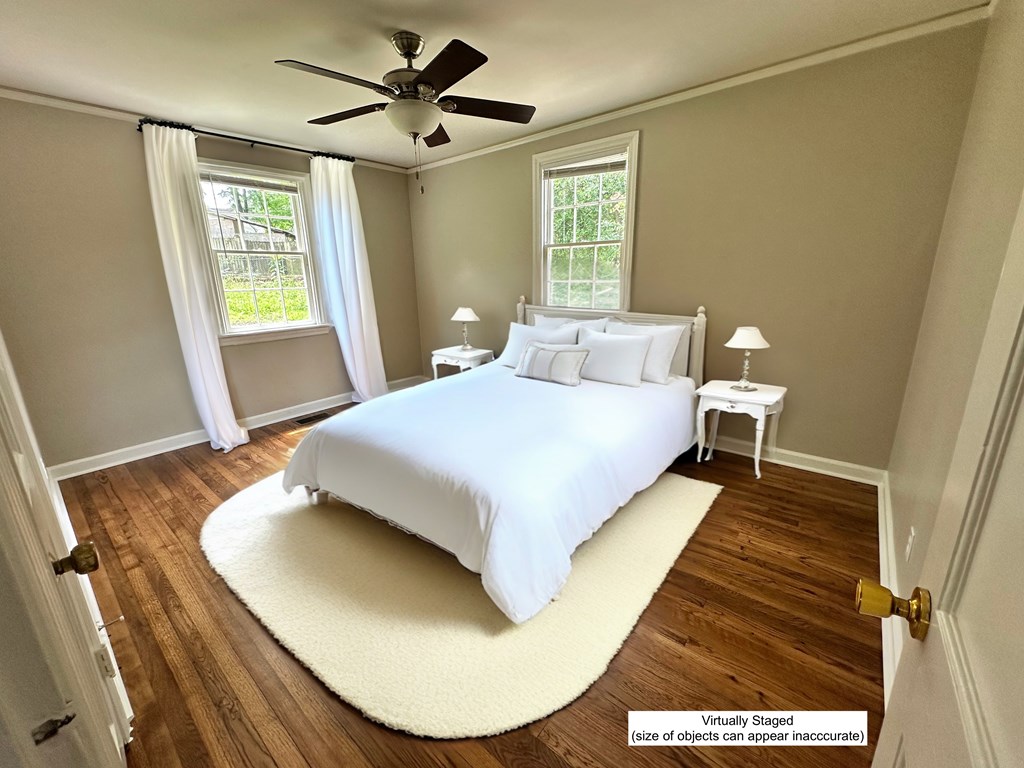 3136 Norris Road Columbus, GA 31907 - Photo 15 of 17 a bedroom with a bed and wooden floor