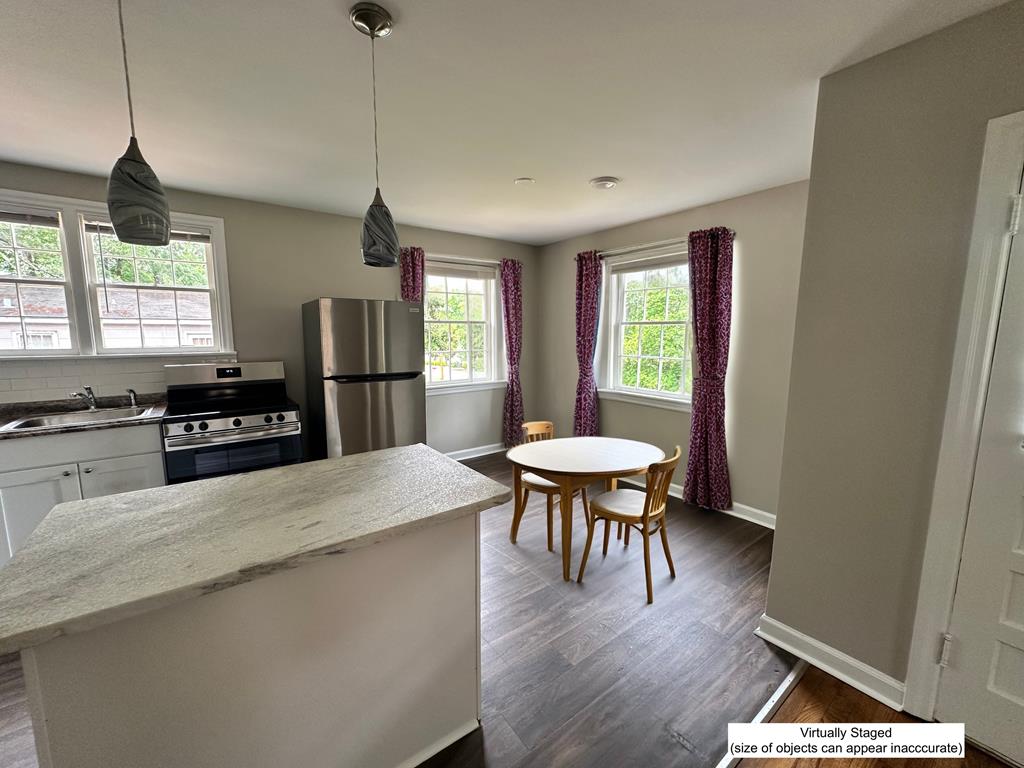 3136 Norris Road Columbus, GA 31907 - Photo 17 of 17 a kitchen with a table and chairs in it