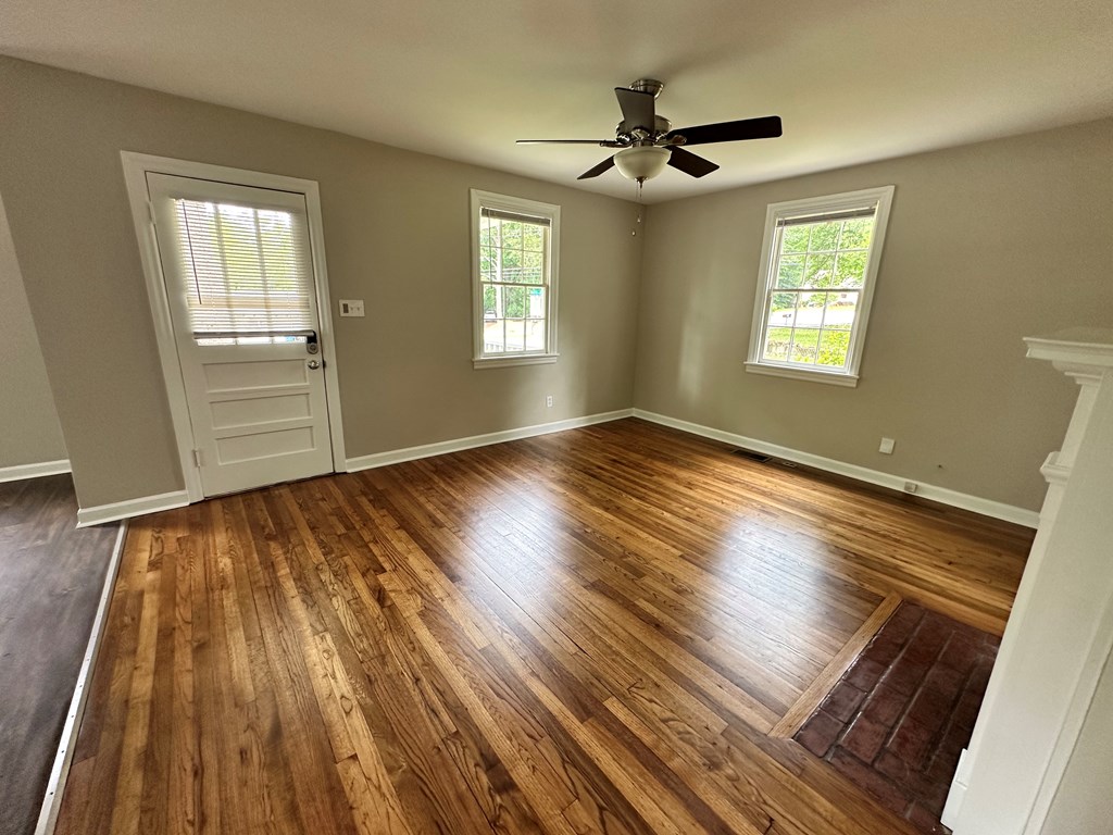 3136 Norris Road Columbus, GA 31907 - Photo 5 of 17 wooden floor in an empty room with a window