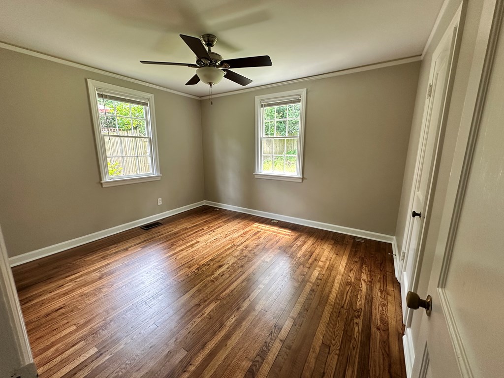 3136 Norris Road Columbus, GA 31907 - Photo 7 of 17 a view of empty room with wooden floor and fan