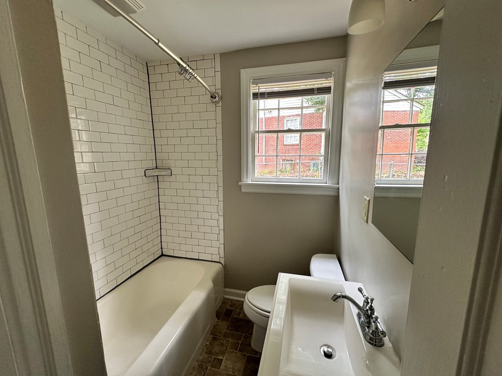3136 Norris Road Columbus, GA 31907 - Photo 10 of 17 a bathroom with a sink and bathtub