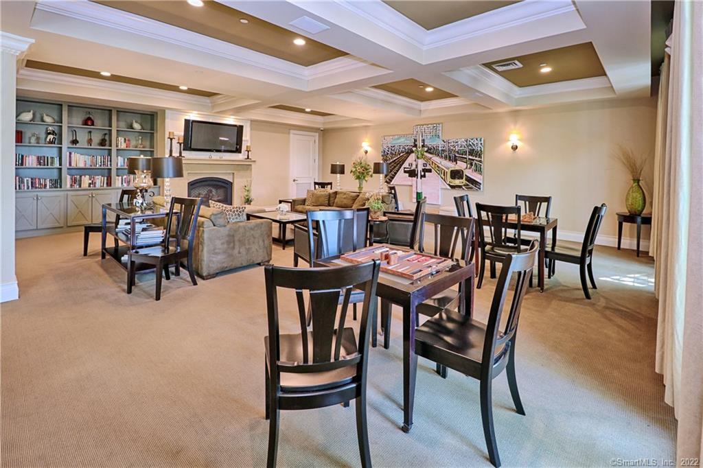 75 Stone Ridge Way, Unit 3E Fairfield, CT 06824 - Photo 17 of 23 The Ridge Club community room offers game tables, large TV, and library