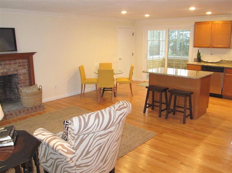75 Beldan Lane Centerville, MA 02632 - Photo 5 of 24 a living room with furniture a large window with kitchen view