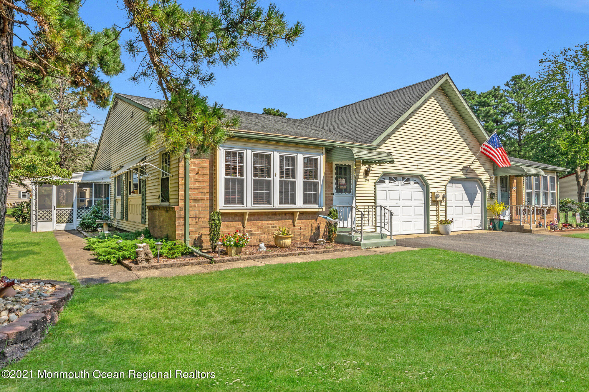 29 A Sunset Road, Unit A Whiting, NJ 08759 - Photo 1 of 40 a front view of a house with a yard and porch