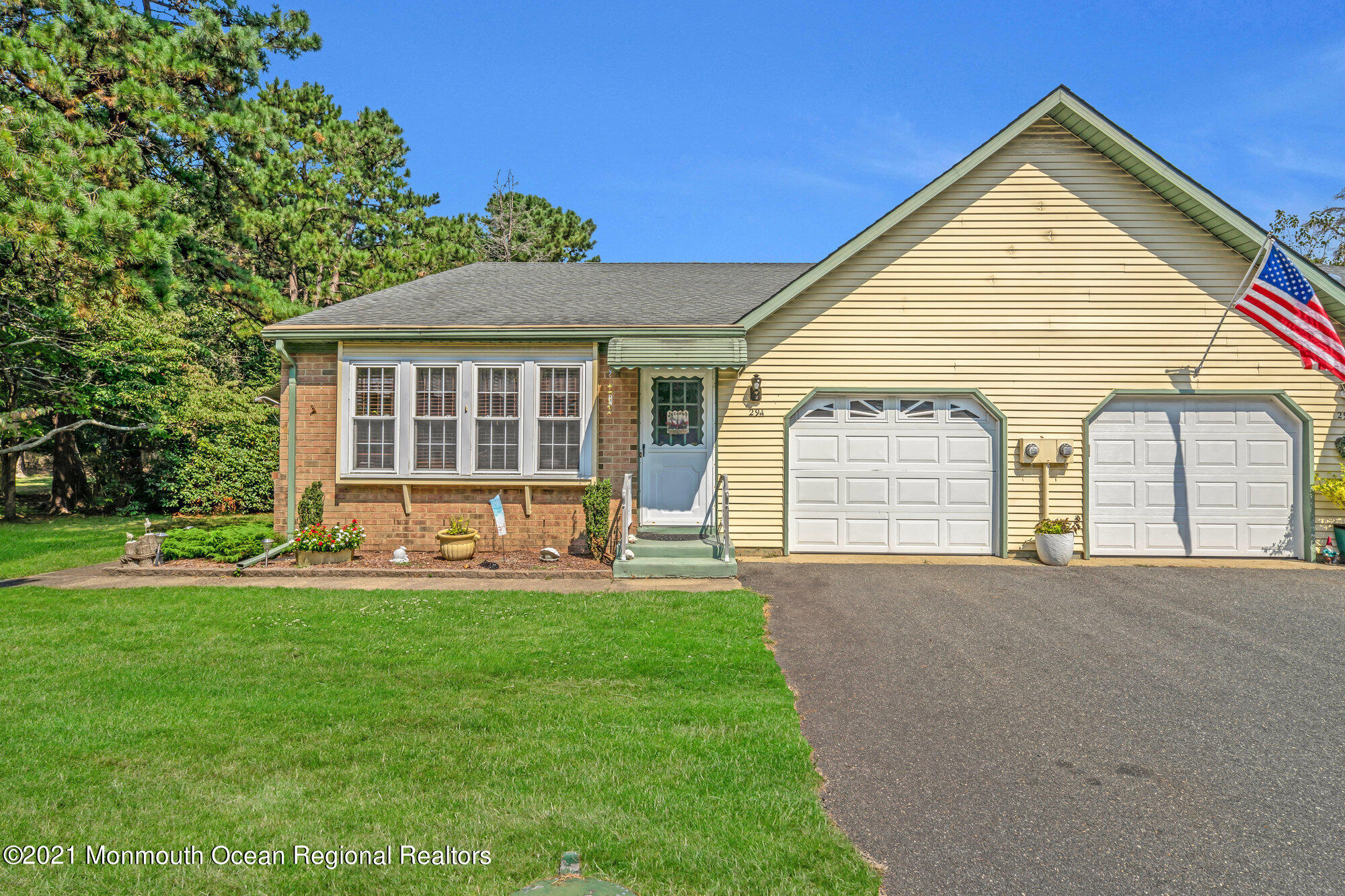 29 A Sunset Road, Unit A Whiting, NJ 08759 - Photo 2 of 40 a front view of a house with a yard and porch