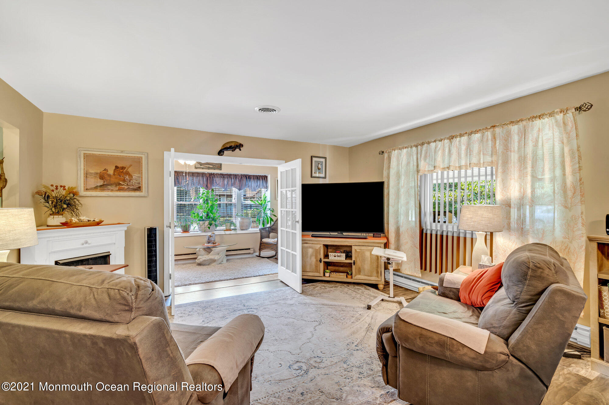 29 A Sunset Road, Unit A Whiting, NJ 08759 - Photo 14 of 40 a living room with furniture and a flat screen tv