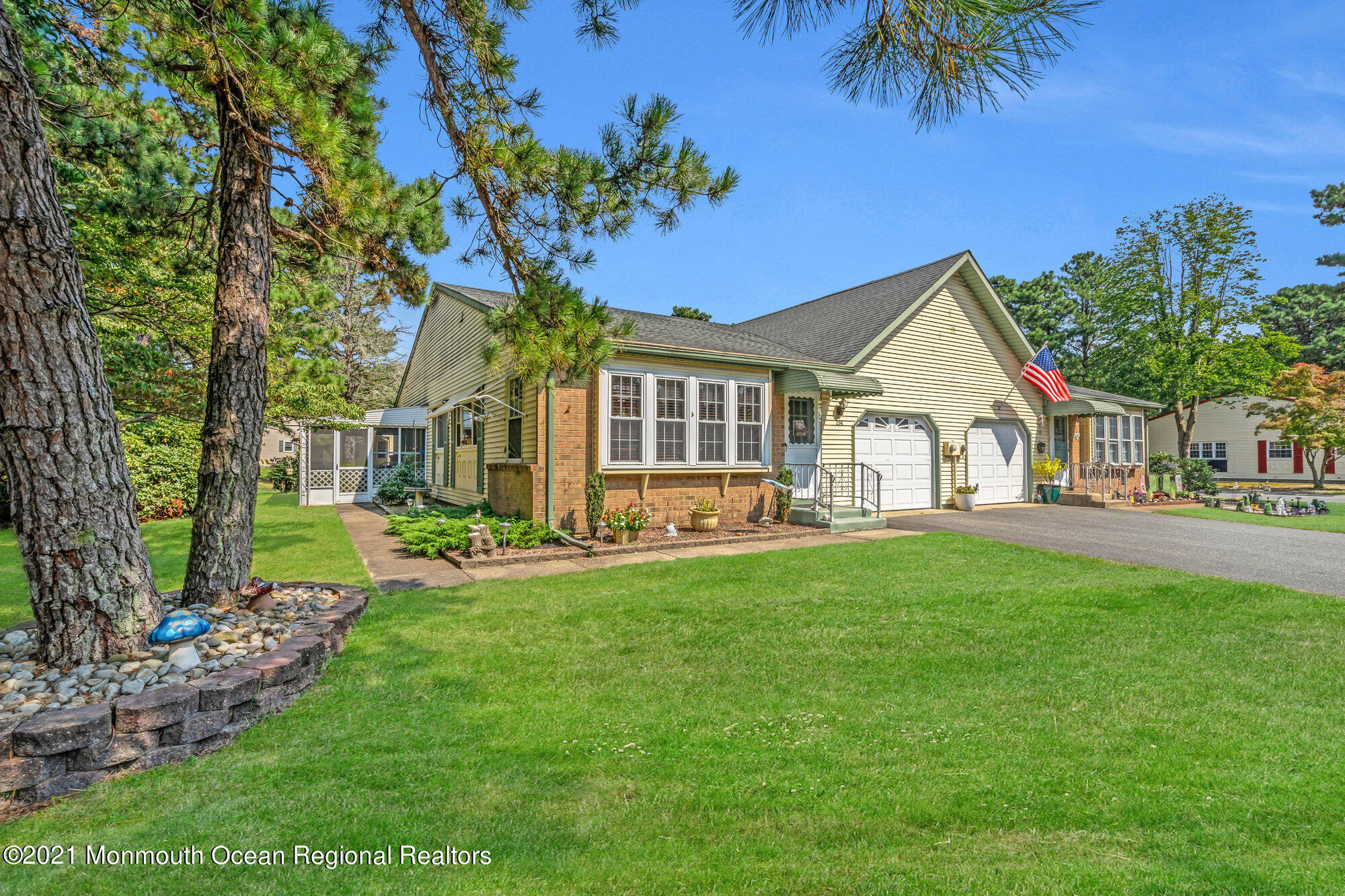 29 A Sunset Road, Unit A Whiting, NJ 08759 - Photo 4 of 40 a front view of a house with a garden and yard
