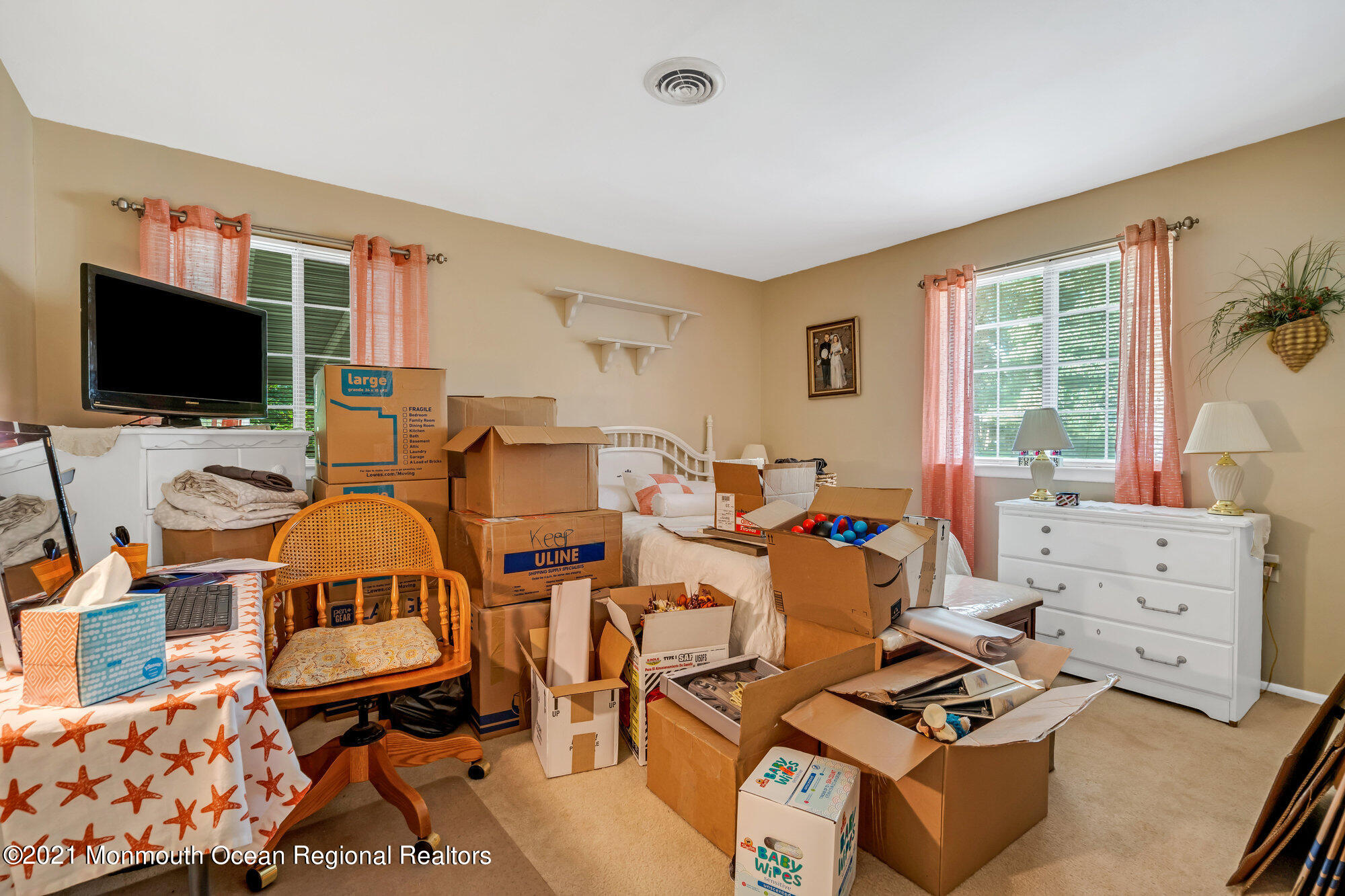29 A Sunset Road, Unit A Whiting, NJ 08759 - Photo 35 of 40 a living room with furniture a flat screen tv and a window