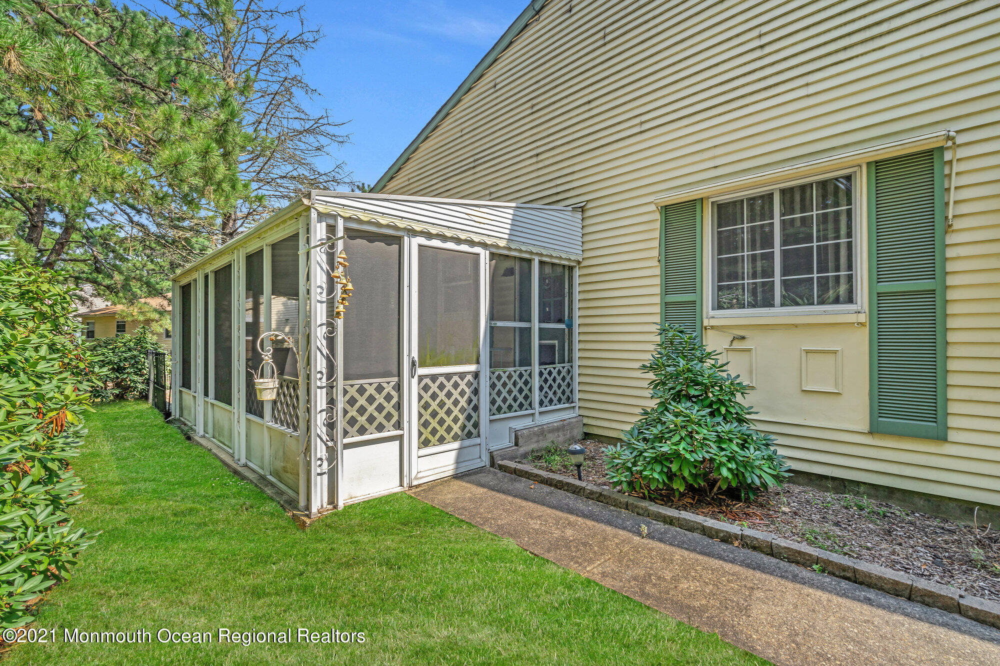 29 A Sunset Road, Unit A Whiting, NJ 08759 - Photo 37 of 40 a view of a house with a yard and potted plants