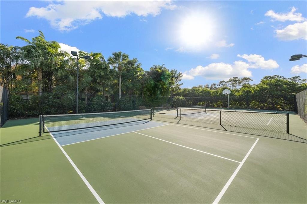 8997 Cambria Circle, Unit 201 Naples, FL 34113 - Photo 29 of 33 a view of a tennis court